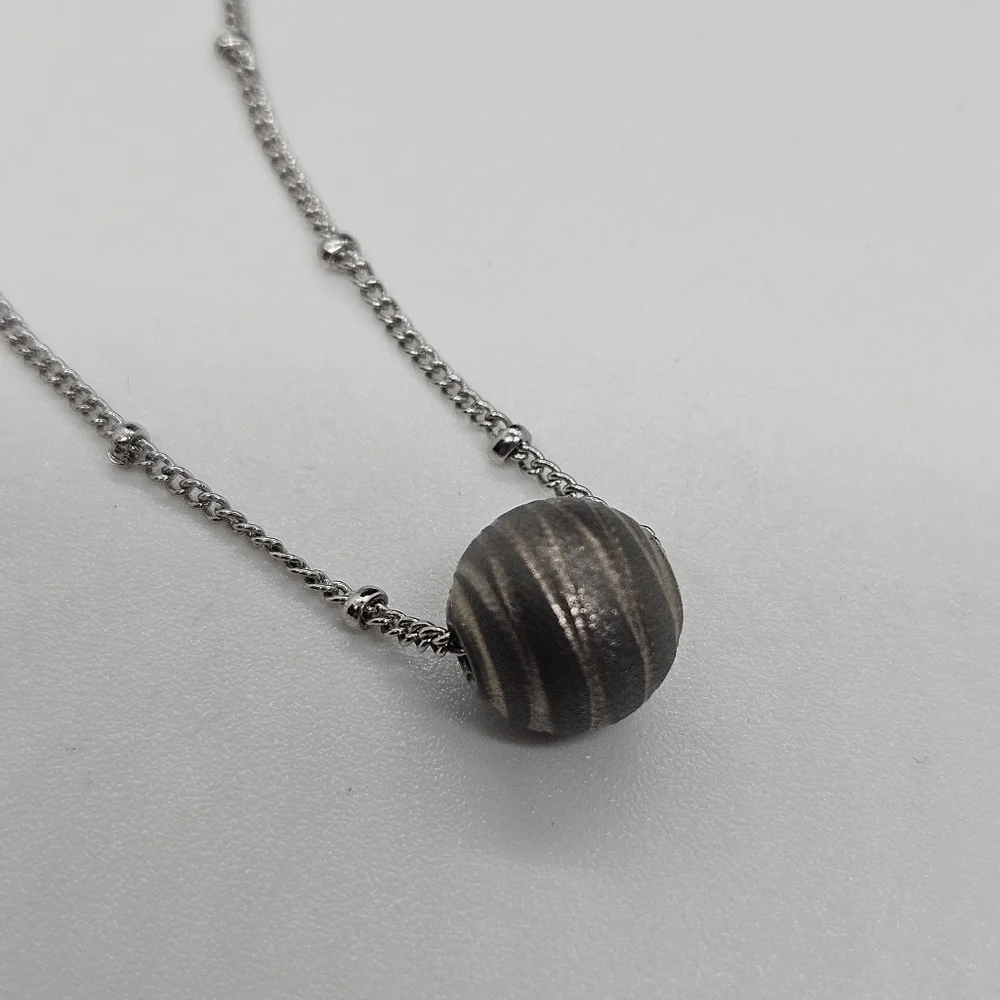 silver tone chain necklace with gray banded bead